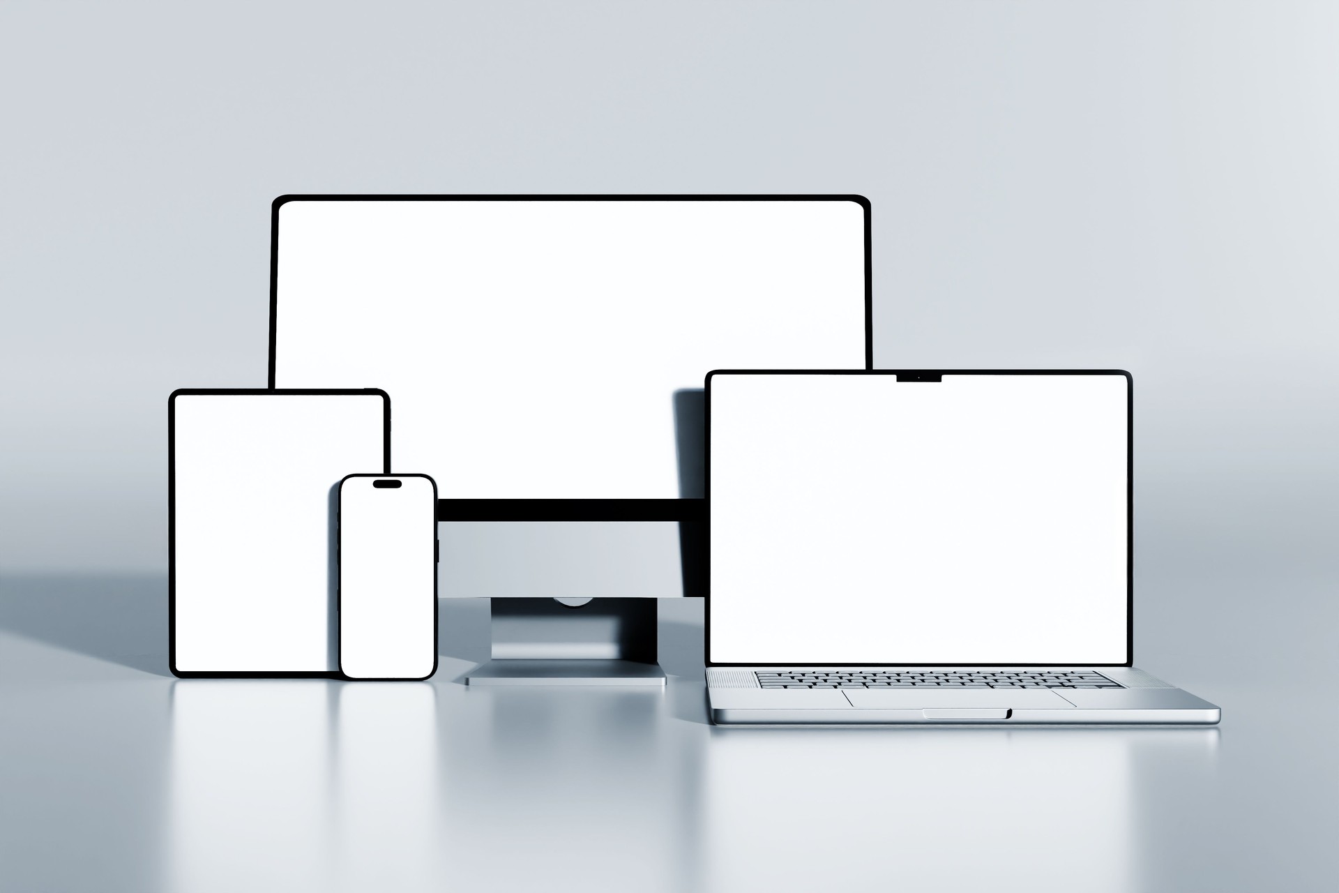 modern electronic devices. smartphone, tablet, laptop, and desktop monitor with blank screen for mockup
